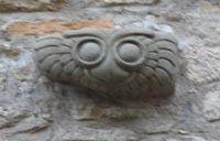 This carving of an owl, set into the wall of a house in the village, recalls Minerva the goddess of wisdom, whose symbol was the owl.